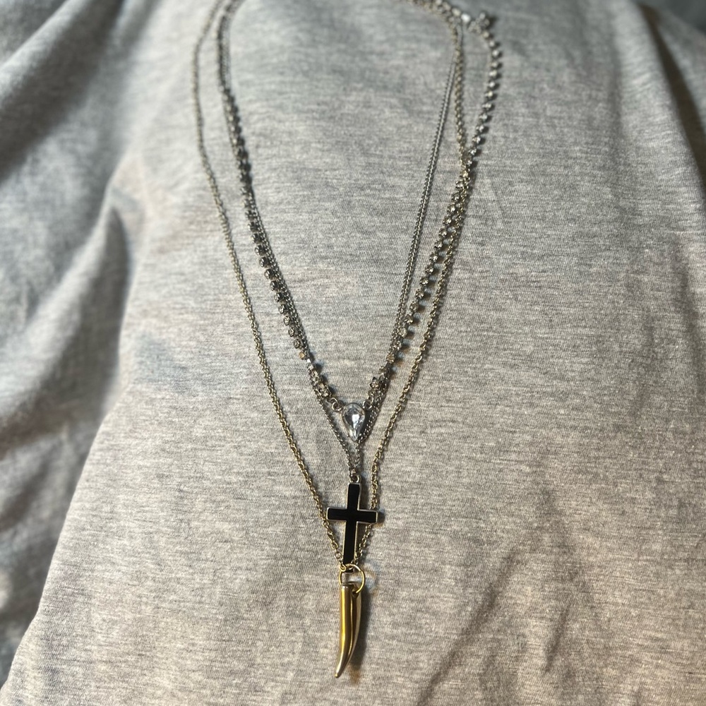 Layered Tricolored Necklace with Cross, Tooth/Claw/Horn, and Rhinestone Pendant